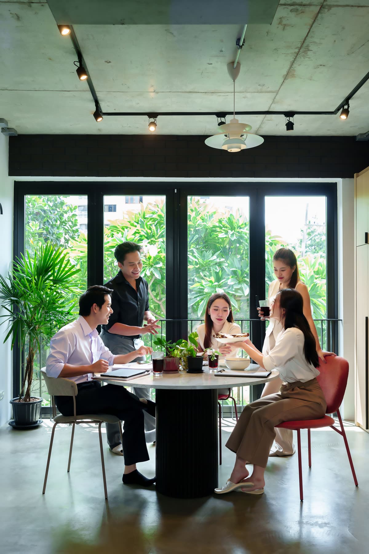 A team gathered around a table in a bright office